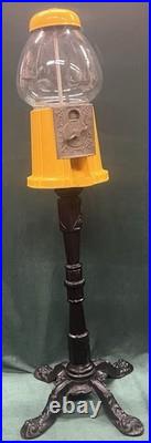 VINTAGE 1940s-1950s CAST IRON GUMBALL MACHINE YELLOW PEDESTAL CANDY DISPENSER