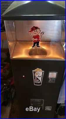 Vintage 1950s heated popcorn vending machine. Works