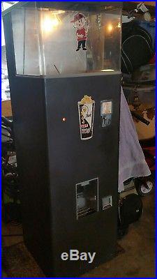Vintage 1950s heated popcorn vending machine. Works