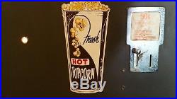 Vintage 1950s heated popcorn vending machine. Works
