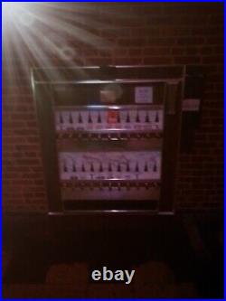 Vintage Cigarette Vending Machine still. Fully operational with blue backlight