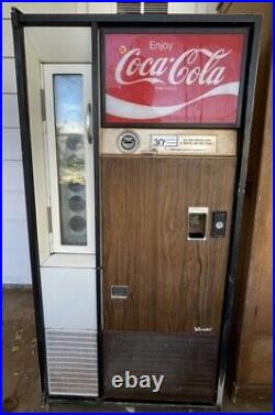 Vintage Coca Cola vending machine by Vendo
