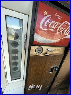 Vintage Coca Cola vending machine by Vendo
