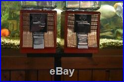 Vintage Northwestern 25 cent Candy machines withembossed globe