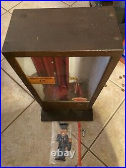Vintage Pulver One Cent Gum Machine working in custom wood cabinet with cop